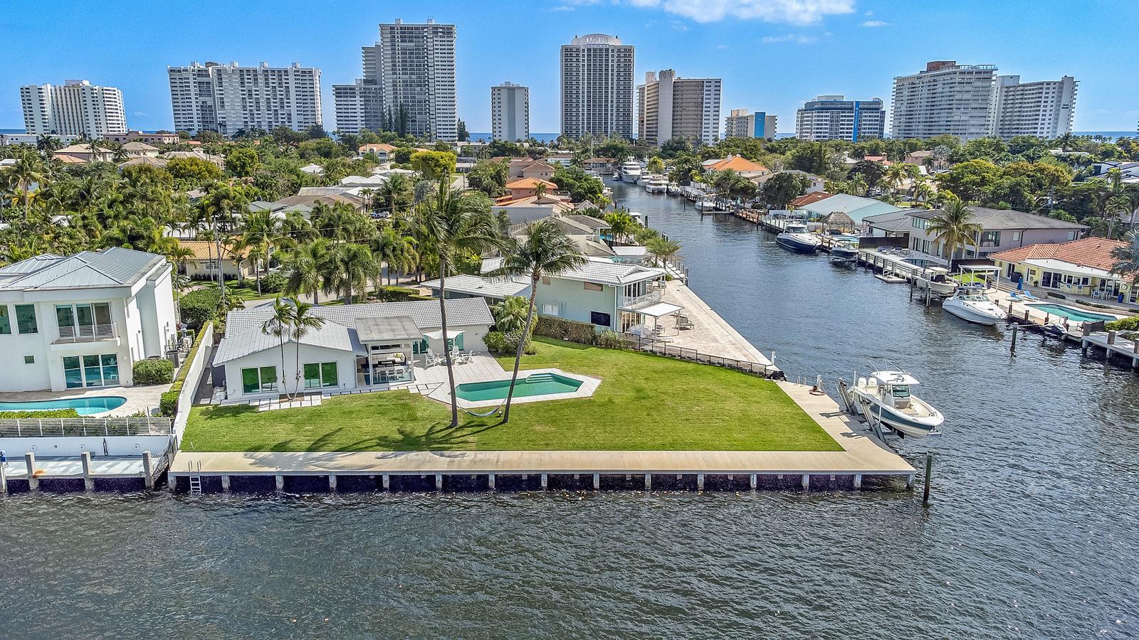 Aerial view of 35 Castle Harbor Isle on a Fort Lauderdale canal, with a pool and boat dock